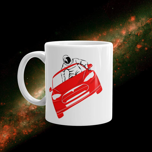 Starman mug inspired by the SpaceX Falcon Heavy Starman in a Tesla launched by Elon Musk. This coffee mug has the astronaut mannequin driving a Tesla Roadster in space with a David Bowie tattoo on his face. 